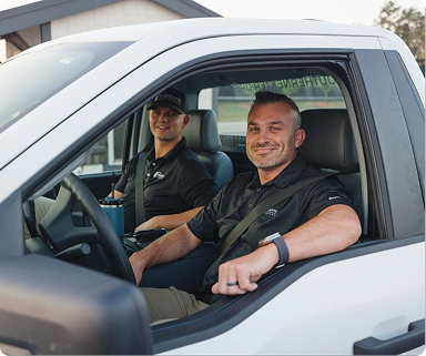 Southern Exteriors team members in a company vehicle