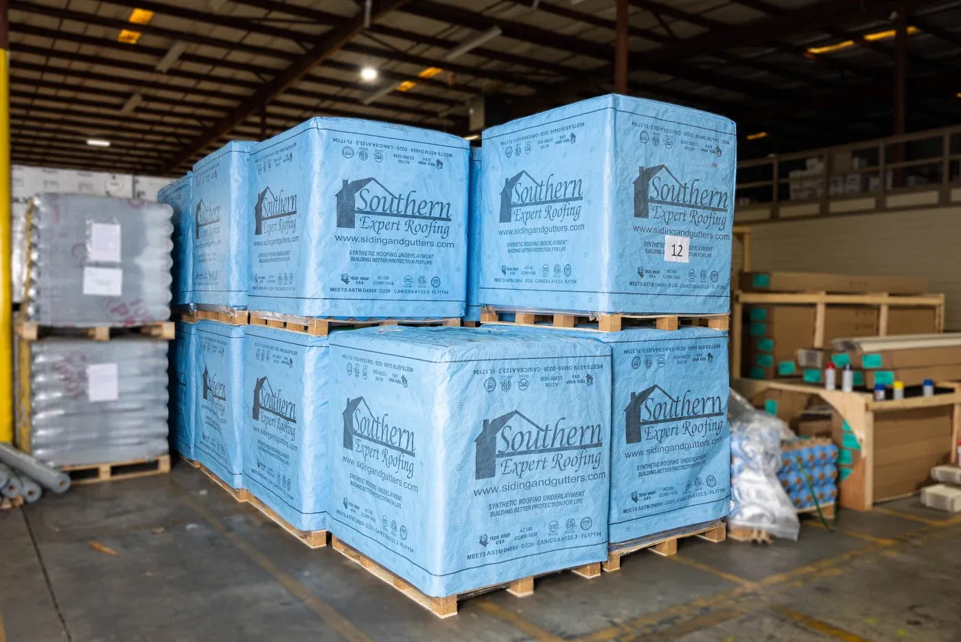 A warehouse filled with roofing and siding supplies for Southern Exteriors.