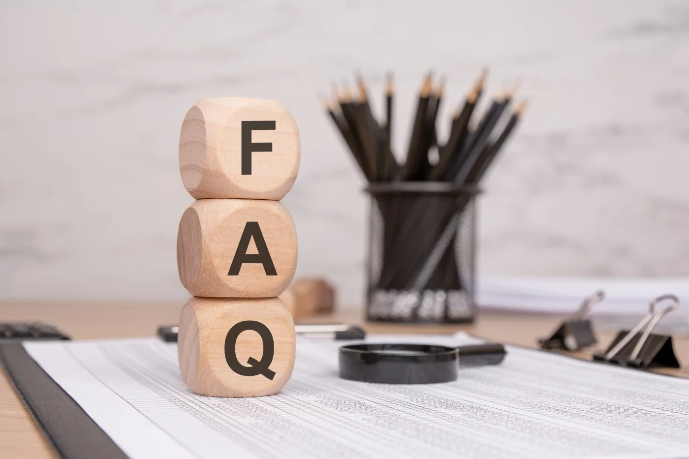 Three blocks that spell out “FAQ”