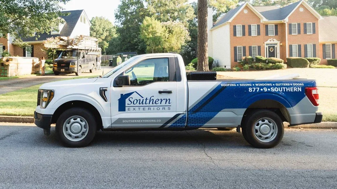 A Southern Exteriors work truck parked in a residential neighborhood.