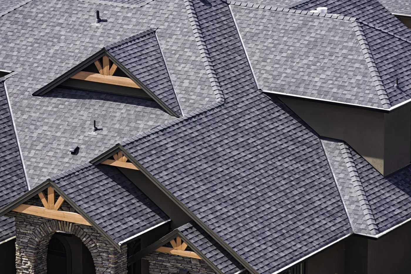 A close-up shot of asphalt shingles on a roof in Woodstock, GA