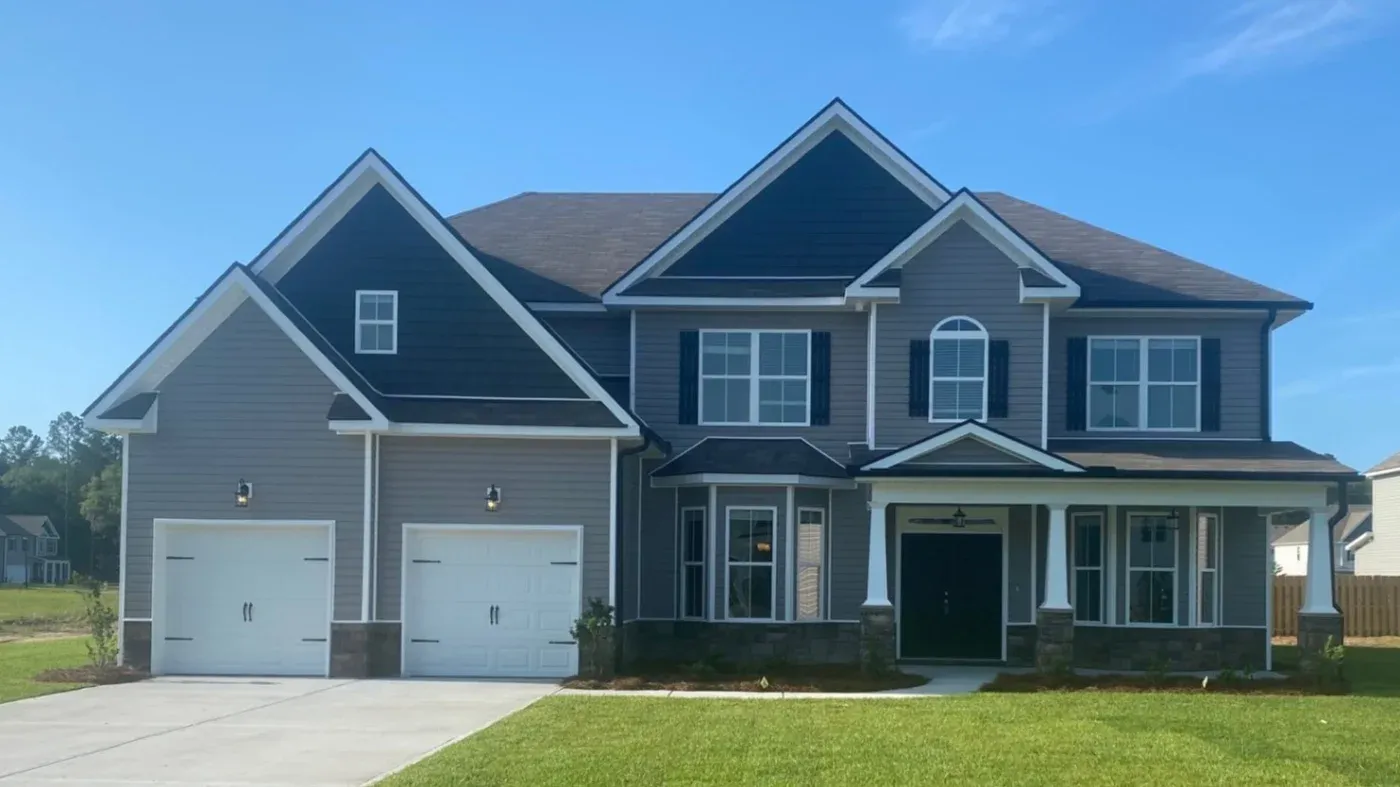 A large home with new siding and roofing, both installed by Southern Exteriors.