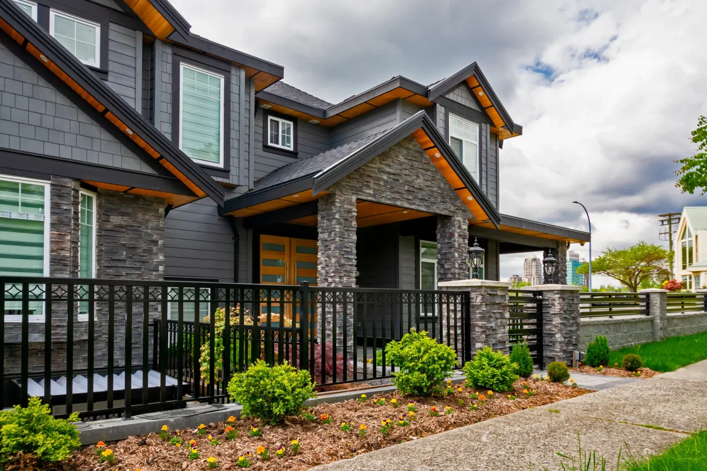 Luxury Residential House With Front Yard Behind Metal Fence
