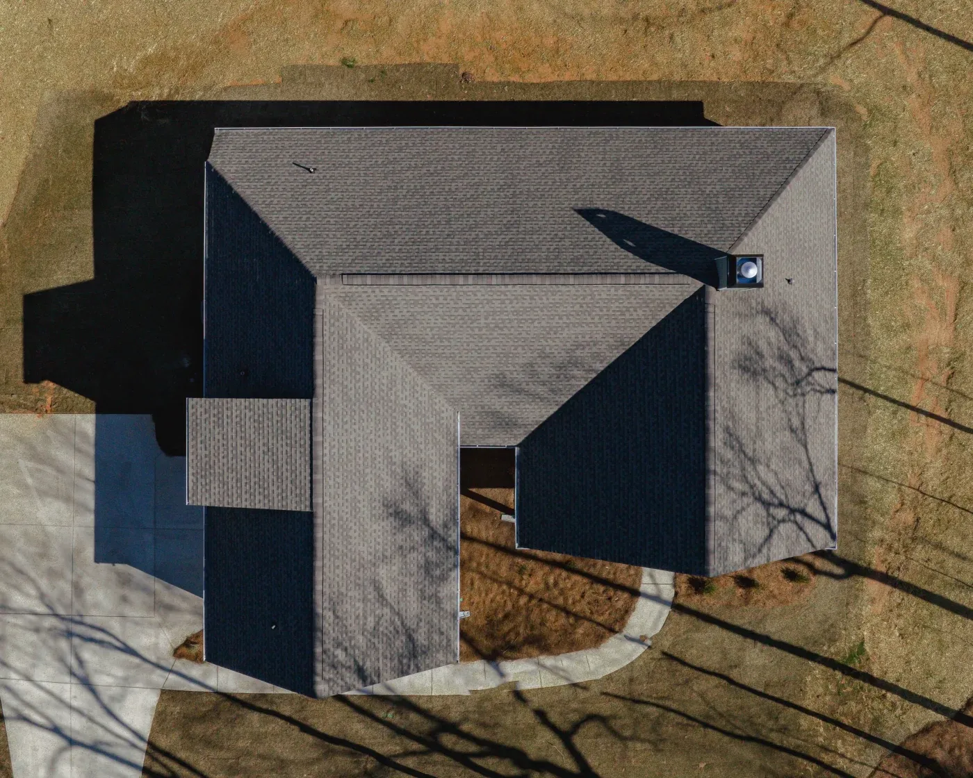 A bird’s-eye view of a new asphalt shingle roof on a North Atlanta home.