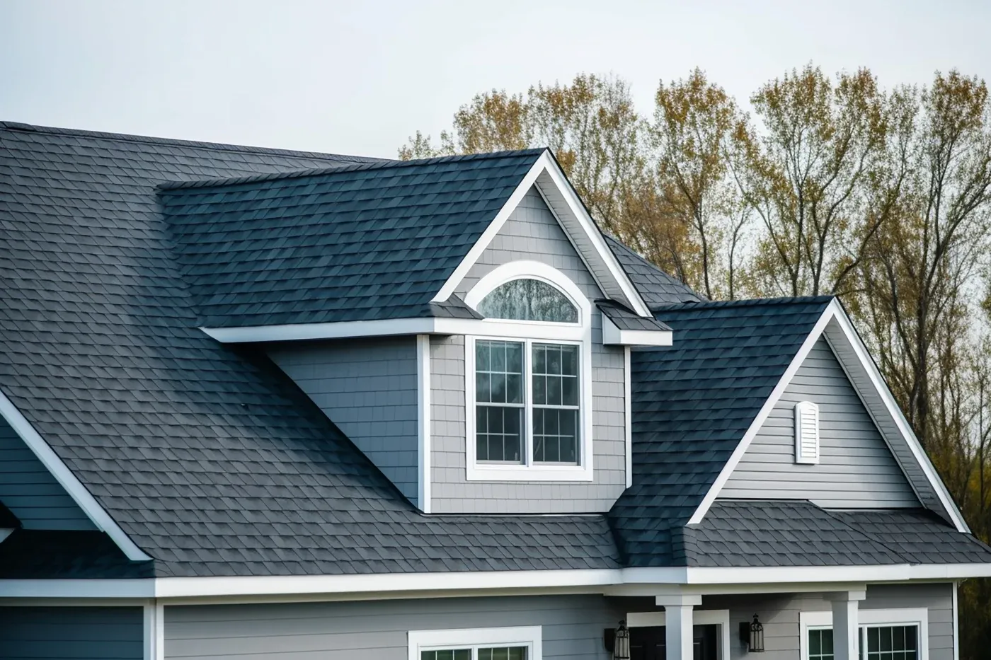 A close-up of an asphalt shingle roof on a house.