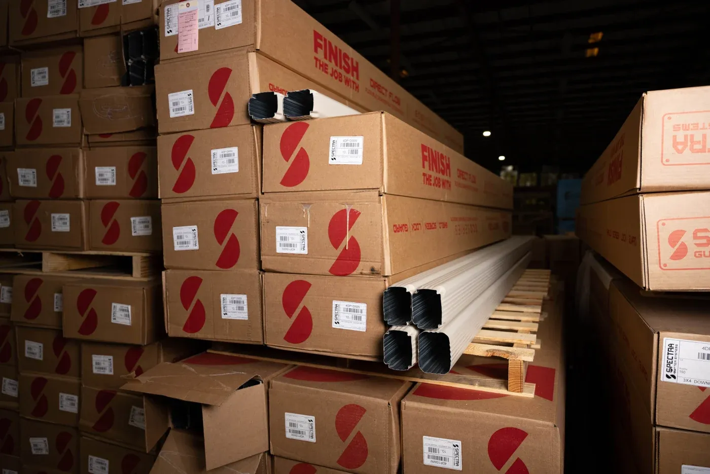 Boxes full of superior gutter products in a Southern Exterior warehouse.