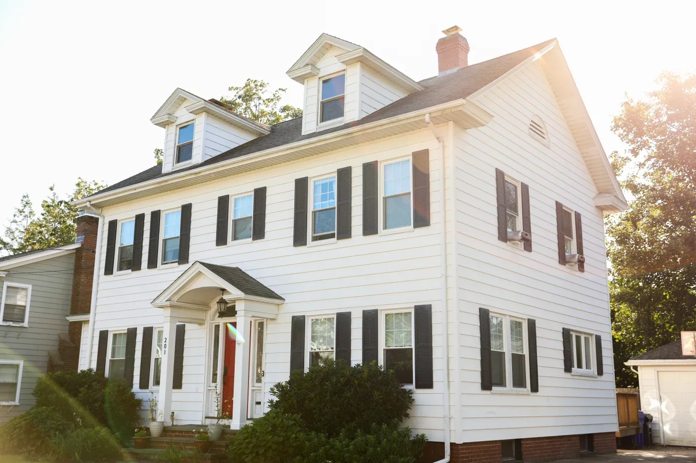 A large North Atlanta home with new white siding.