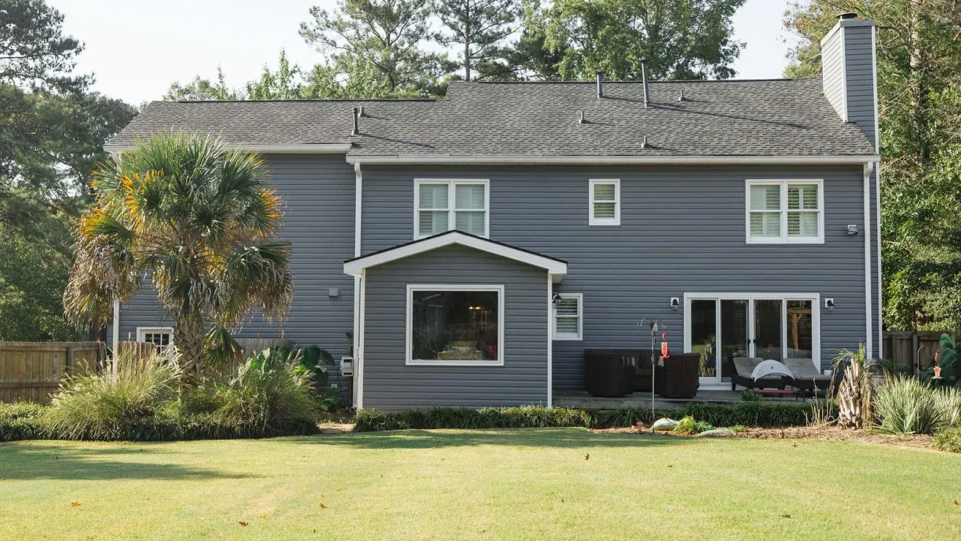 Stormy blue-gray vinyl siding with white trim on a home in Canton, GA