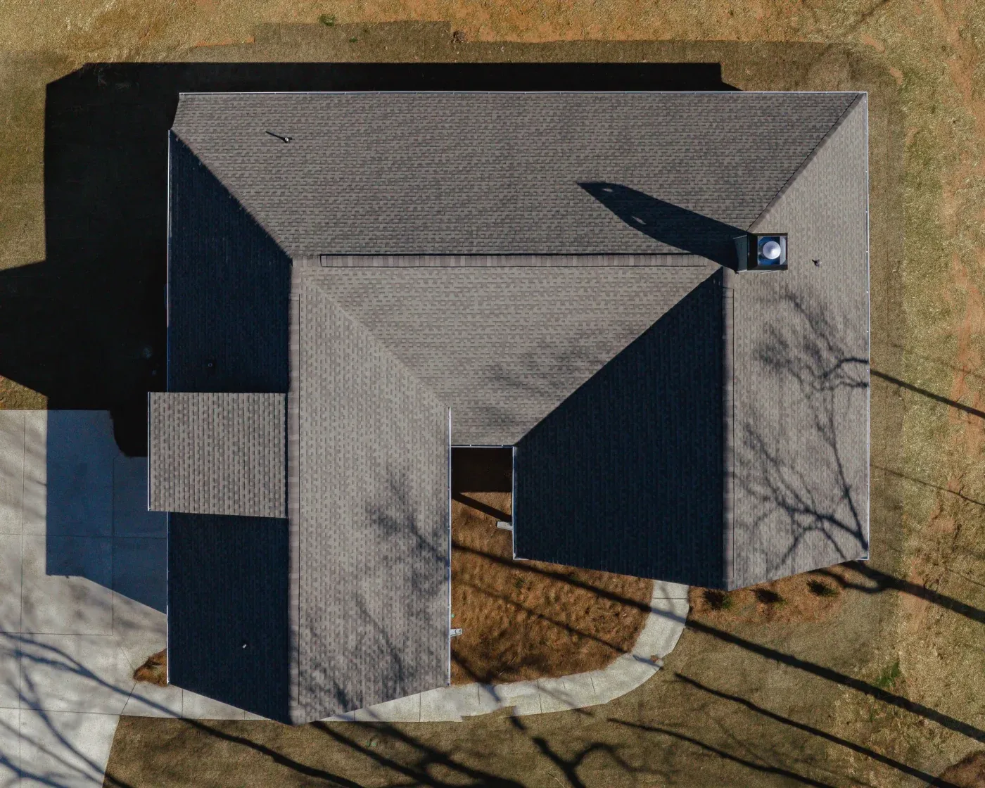 An aerial view of a newly installed asphalt shingle roof in North Atlanta.