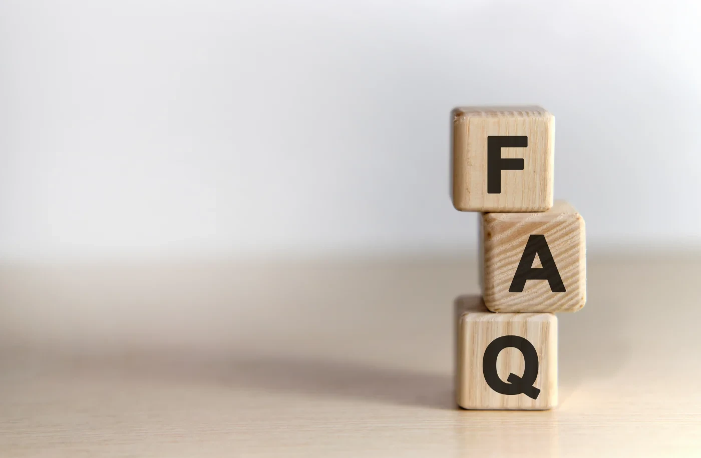 Three blocks stacked together that spell “FAQ”