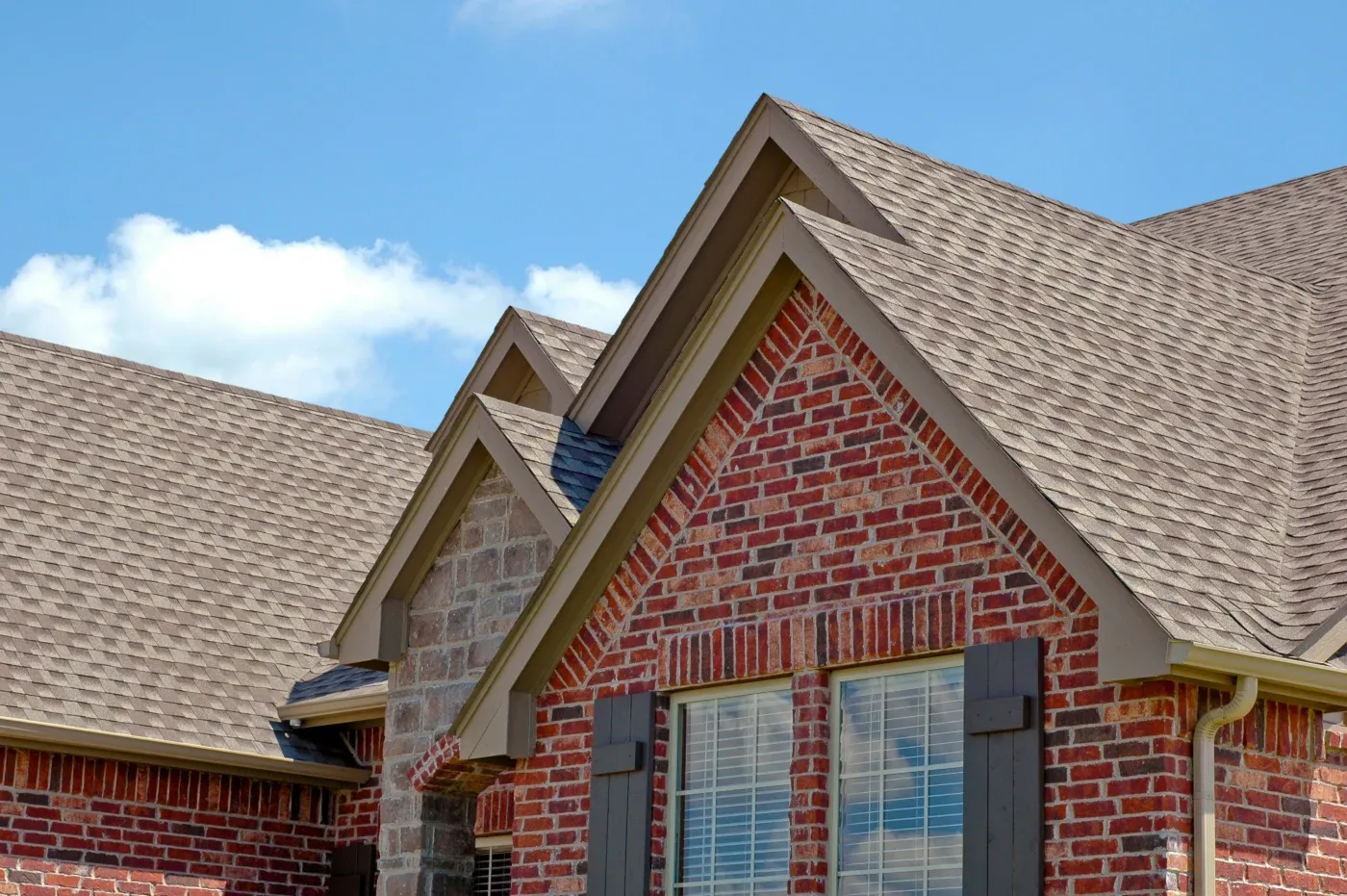 A beautiful new roof installed on a brick home in Atlanta, GA