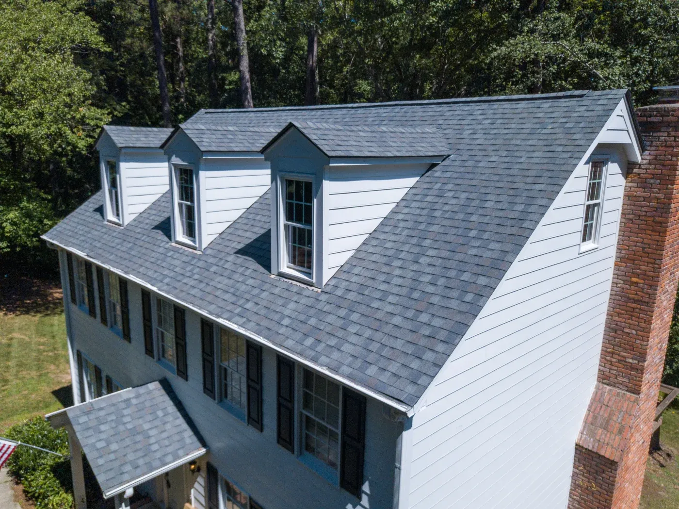 A wide shot of a newly shingled roof on a home in Georgia