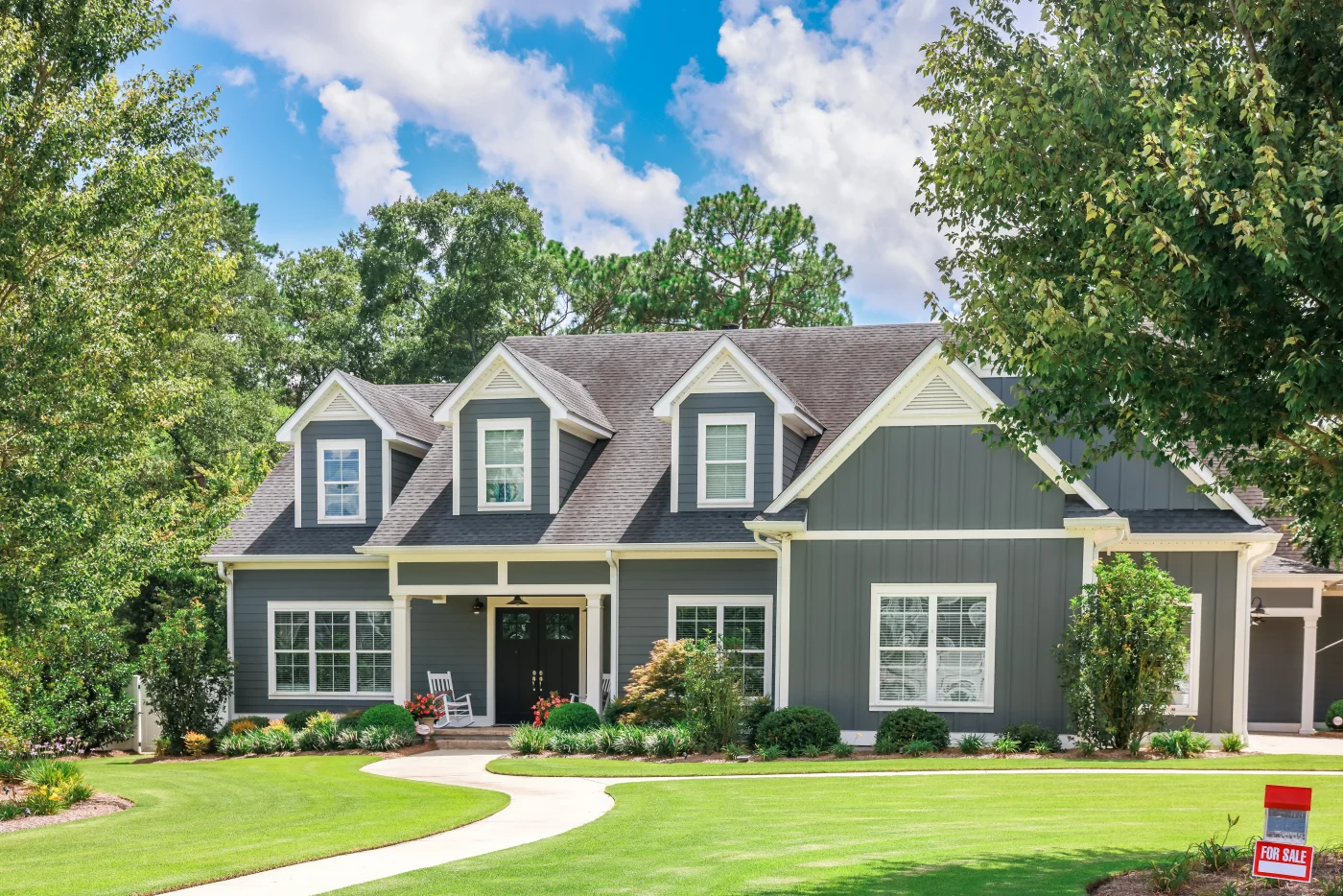 A Large Gray Craftsman New Construction House With A Landscaped Yard And Leading Pathway Sidewalk A Large Gray Craftsman New Construction House With A Landscaped Yard And Leading Pathway Sidewalk