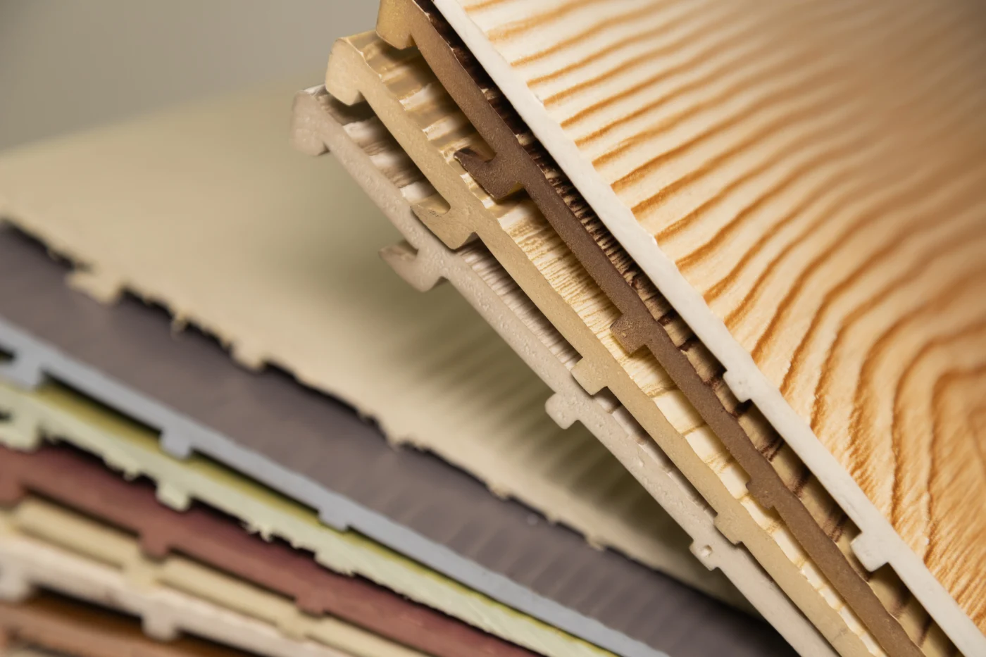 Several high-quality siding samples arranged on a table